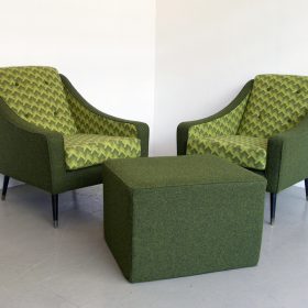 green colored fabric upholstery armchair