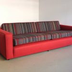 red colored upholstery couch