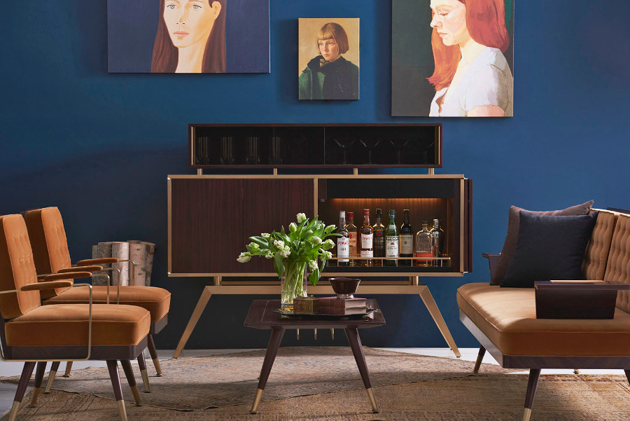 An upholstery image set showing a sofa, table, bar counter and beautiful sketches hanging on the wall.